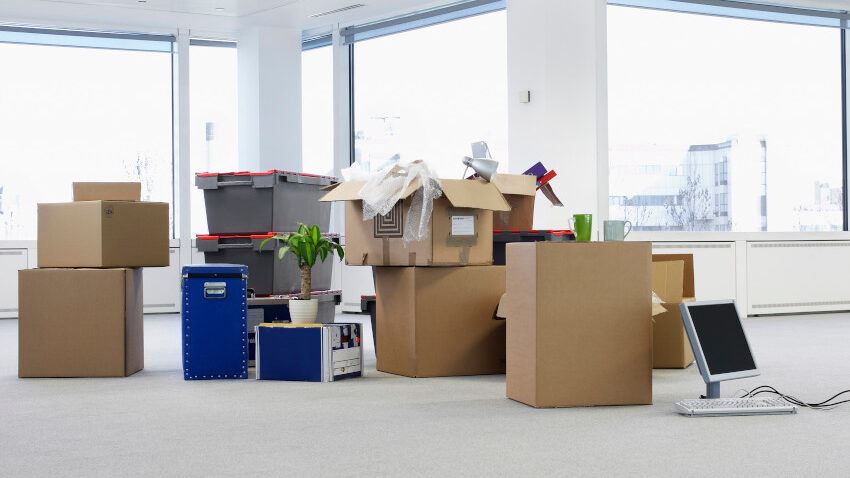 picture of ready for office removal cartons and equipment on floor of empty office space